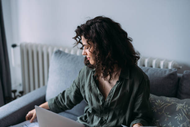 istock A Happy Beautiful Businesswoman Using Her Computer While Working From Home 1588091337