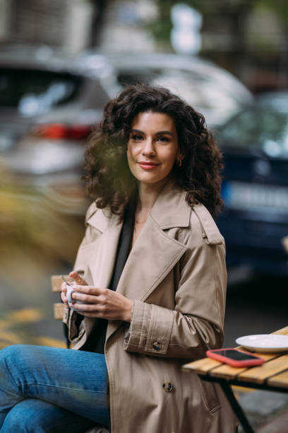 istock A Happy Beautiful Businesswoman Looking At Camera While Sitting At The Cafe 1588091901