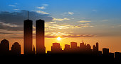 New York skyline silhouette with Twin Towers at sunset. American Patriot Day banner.