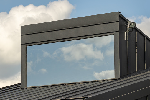 Dormer window in a family home with a wide panoramic window