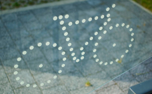 Bicycle sign on a glass close up.