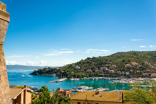 Beautiful view of the bay and the port of Porto Santo Stefano from the side of the Spanish fortress. Commune of Monte Argentario, Grosseto. Copy-space.