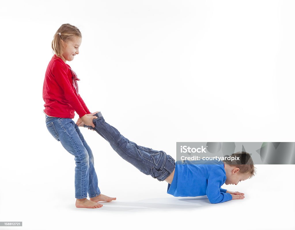 brother and sister having fun brother and sister having fun with each other - isolated on white Boys Stock Photo