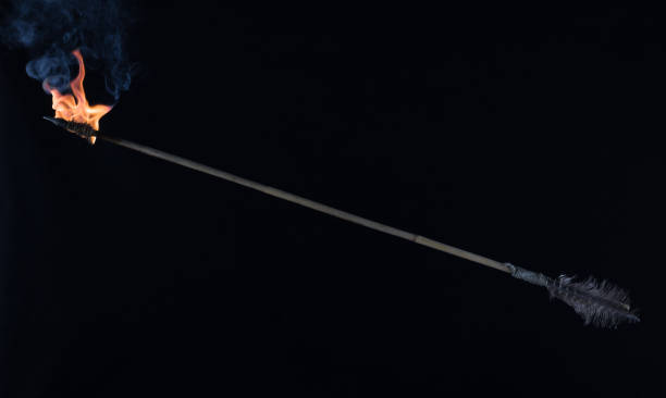 istock flying burning arrow on black background 1588149527