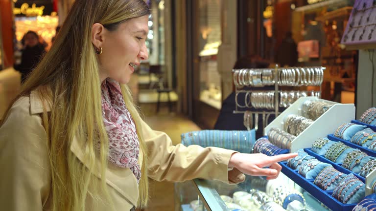 Woman choosing jewelry on Grand Bazaar in Istanbul