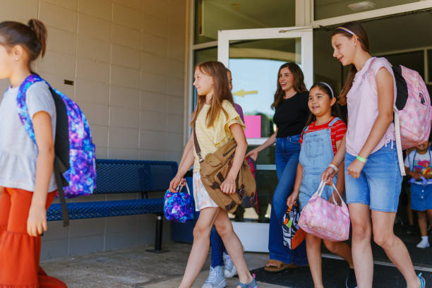 istock Students leaving school at the end of the day 1588211913