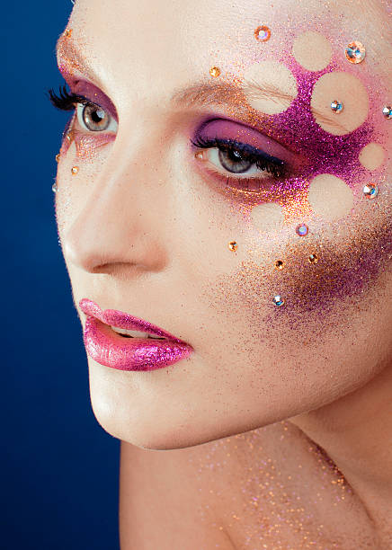 Double Exposure Of Woman With Flower Fields On Face