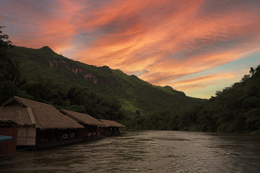 The photo of the sunset on the floating house in the river, Karnchanaburi, Thailand