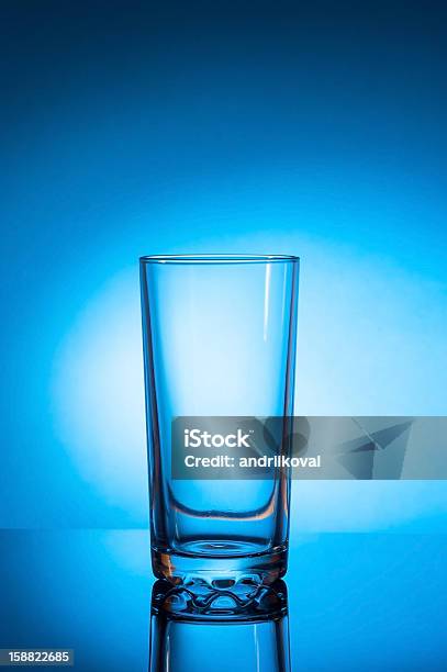 Empty Glass On Blue Background Stock Photo - Download Image Now - Blue, Clean, Close-up