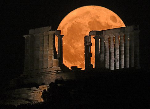 Super Moon over The Temple of Poseidon at Sounion on the Athenian coast of Greece\nStraight telephoto shot with no image manipulation
