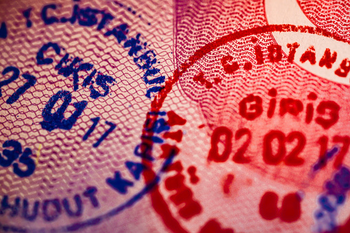 arrival and departure stamps on a Turkish passport page