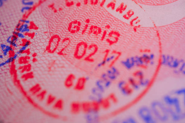istock red and blue stamps on a passport page 1588247450