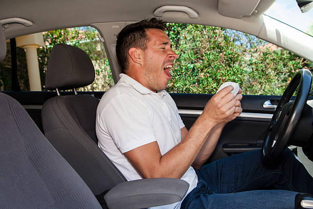 istock Man sneezing in car 158827312
