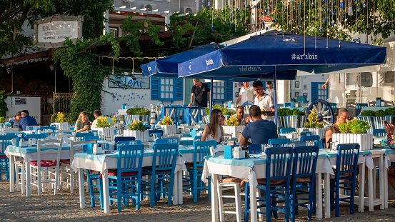 Gökçeada Çanakkale, Turkey July 22, 2023: View of the touristic Kaleköy street and the harbor restaurants from the central area of Gokceada. Gokceada is the largest island of Turkey.