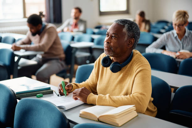 istock Black senior man student during a lecture in the classroom. 1588286820