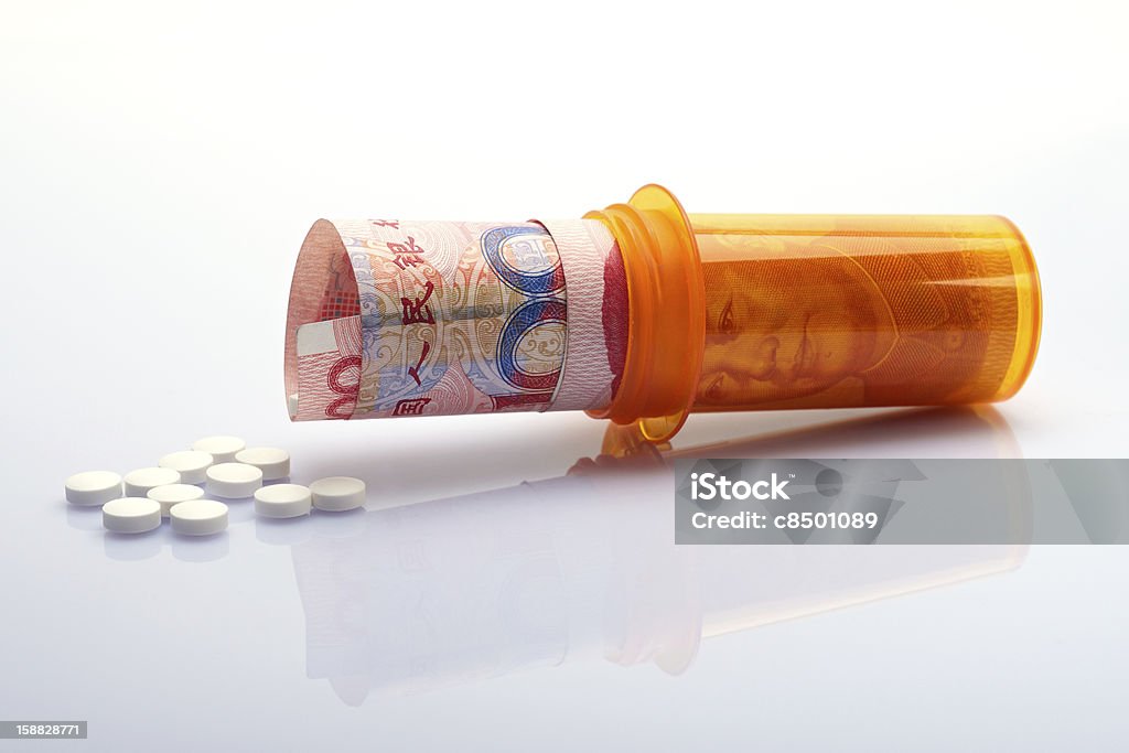 Chinese Medication Prescription bottle with Chinese money and pills Chinese Culture Stock Photo