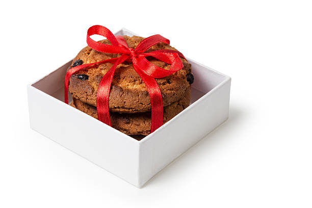 Suffolk, Virginia, USA - December 18, 2011: A horizontal studio shot of a Godiva chocolate gift basket decorated with gold ribbon, bow, and Christmas baubles.