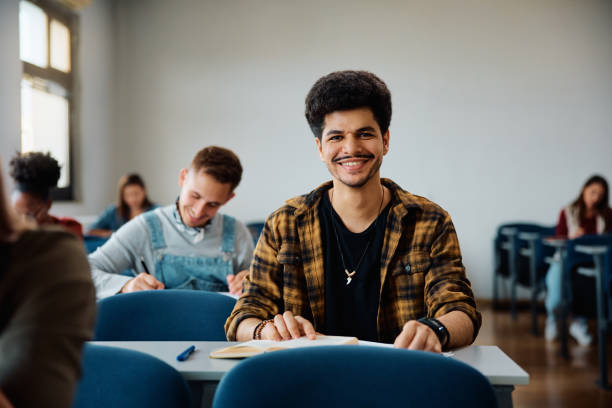 istock Happy Muslim student in university classroom looking at camera. 1588290504