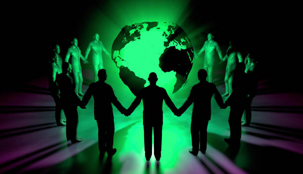 istock People Holding Hands Around Green World 1588308022