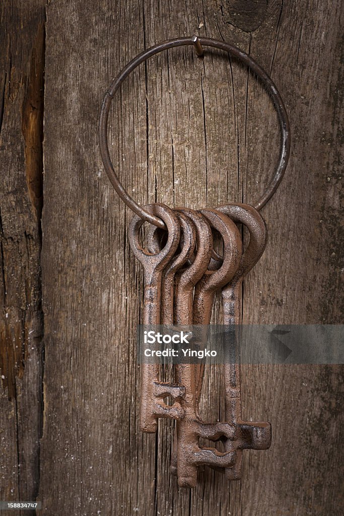 Old keys Bunch of old keys on a wooden background Antique Stock Photo