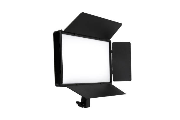 istock Photo and video lamp isolate on white background. LED lamp with special shutters for the formation of light flux. Photo and video lighting fixture. 1588365657