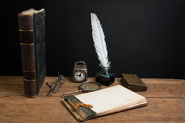 istock Quill, inkwell, book, magnifying glass, notepad, clock, spectacles 158844720