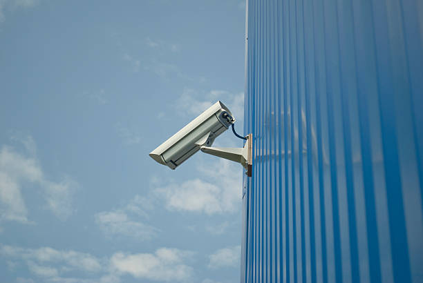 istock Surveillance camera in the blue building 158847042