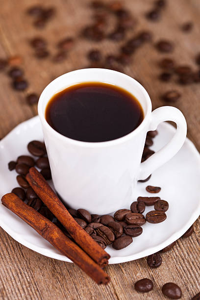 cup of coffee and cinnamon stock photo