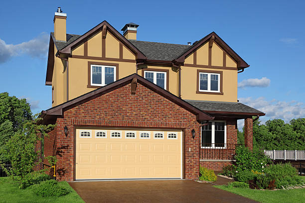 istock New two-storied brown cottage with built-in garage. 158848934