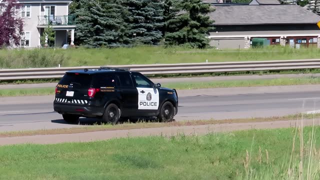 A Police SUV patrol vehicle on the route during a hot day of summer