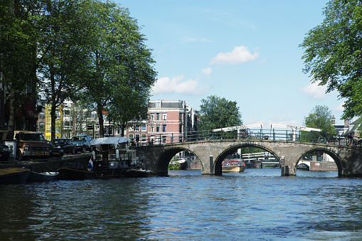 Amsterdam canals and typical houses with clear spring sky