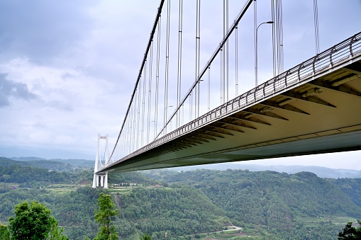 Tengchong City, Baoshan City, Yunnan Province, China.\nLongjiang Bridge, located in the western part of Yunnan Province and the southern section of Hengduan Mountain Range, is the largest steel box girder suspension bridge with span in the mountainous areas of Asia. The bridge is 2,470.58 meters long and 33.5 meters wide. It is the busiest bridge in western Yunnan.\nIt is already a famous scenic spot, and many tourists come to visit it every day.