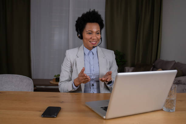 istock Fashionable woman working at home 1588574183