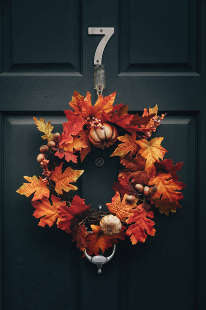 Harvest Haunts: Halloween Wreath with Autumn Accents Graces the Front Doo