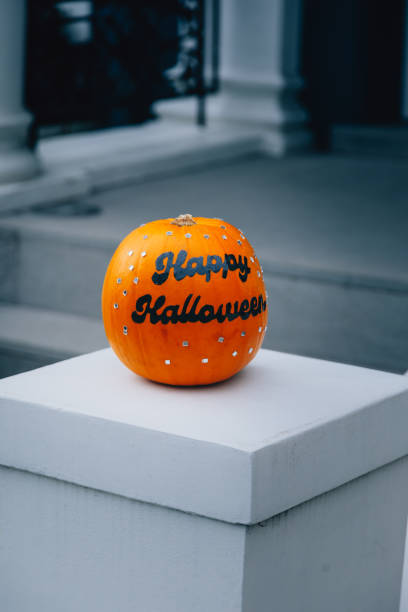 istock Happy Halloween text on a autumn holiday pumpkin 1588587225