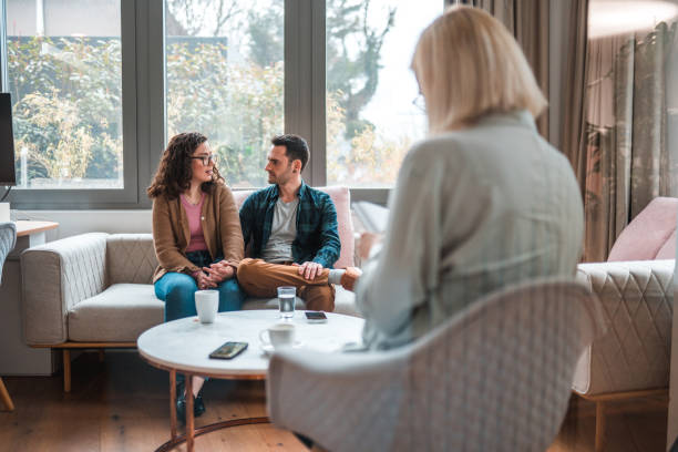 istock Married Mid Adult Couple Seriously Talking at Therapy 1588600960