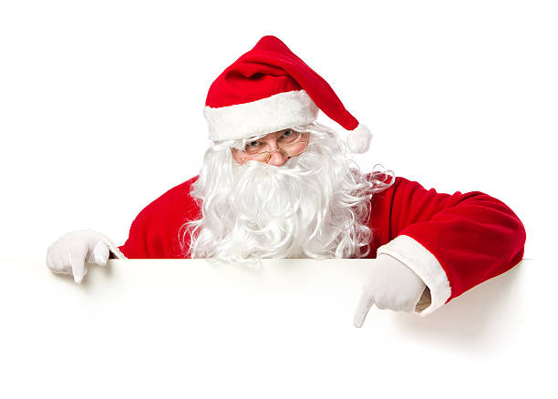 Santa Claus pointing on blank banner stock photo