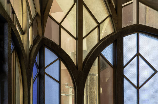 istock Antique multicolored stained glass window panel are decorated in monastery chapel. 1588602578