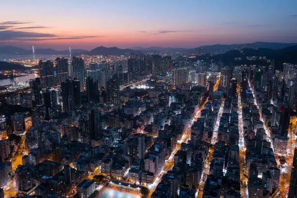 Drone fly over Hong Kong city at night