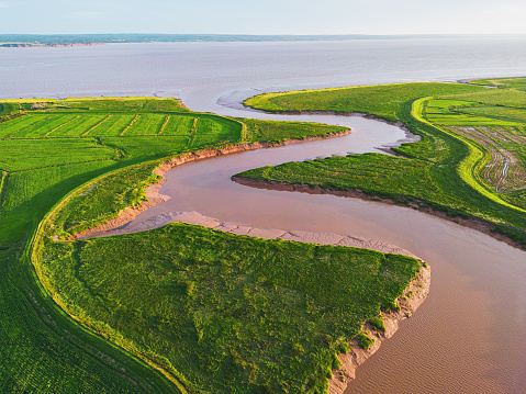 Summer evening aerial view of a tidal river on the Bay of Fundy.
