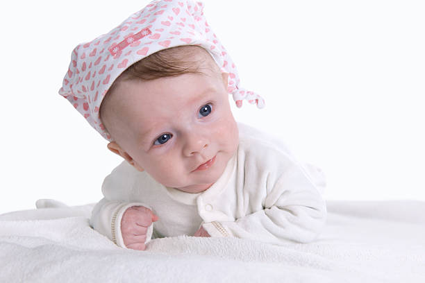 Baby boy is lying on his belly stock photo