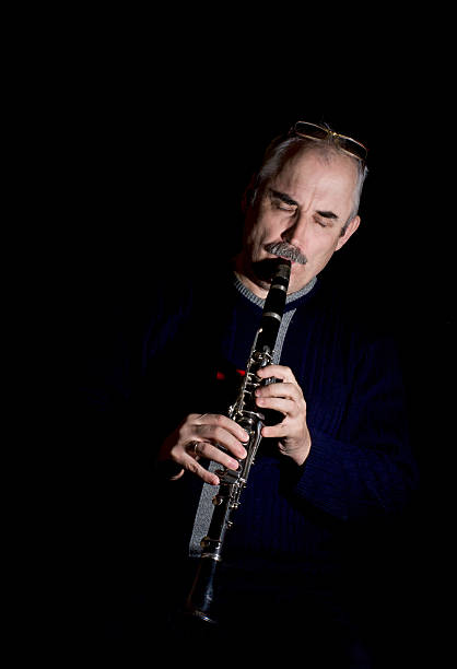 istock Mature man playing the clarinet jazz 158863691