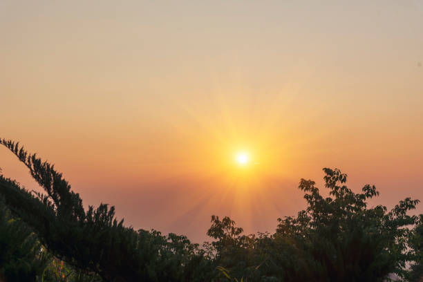 istock Scenic view dramatic beautiful sunset sky. Natural Sunset Sunrise on meadow silhouette shadow dark land. Vibrant dramatic sky on sunset, dawn, sunrise in Countryside. Landscape Colorful Sky At Sunset 1588691395
