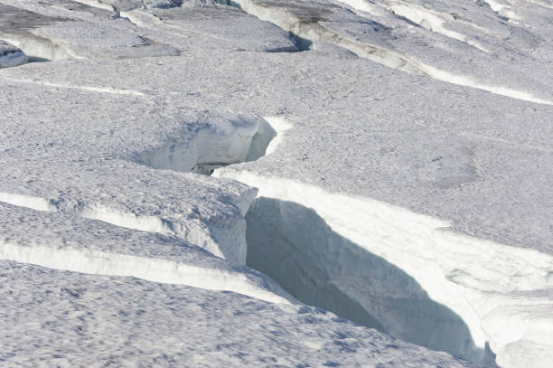istock Norwegian  mountain glacier with dangerous crack in the ice 1588696575