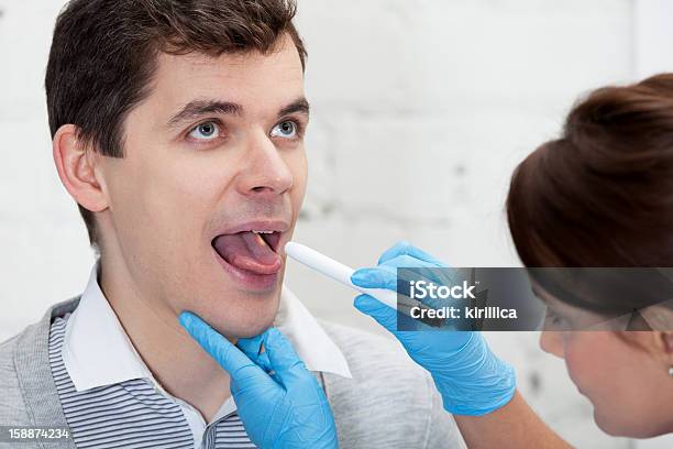 Chicking Throat Stock Photo - Download Image Now - Adult, Care, Doctor