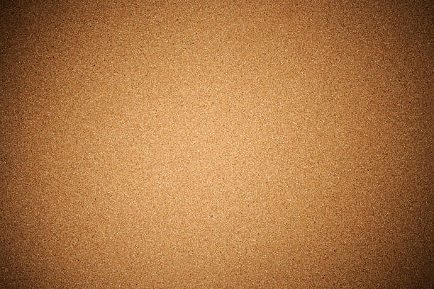 Corkboard texture background with spotlight Close-up of corkboard texture background with spotlight. bulletin board stock pictures, royalty-free photos & images