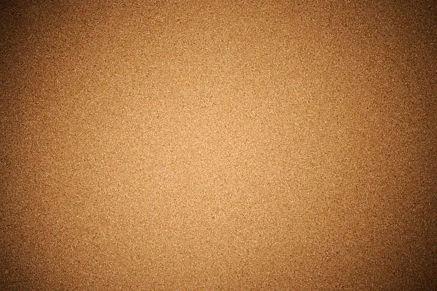 Close-up of corkboard texture background with spotlight.