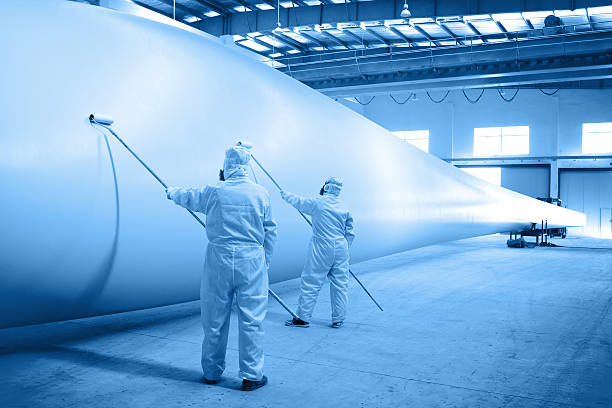 Painting for Wind turbine blade Painting for Wind turbine blade in workshop blade stock pictures, royalty-free photos & images