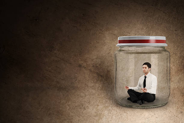 istock Businessman meditating in jar 158877850