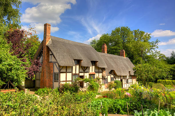 Anne Hathaway's Cottage in Shottery, Warwickshire, England Anne Hathaway's Cottage, the farmhouse where the wife of William Shakespeare lived as a child, is in the village of Shottery, Warwickshire, England, about 1 mile west of Stratford-upon-Avon. william shakespeare photos stock pictures, royalty-free photos & images